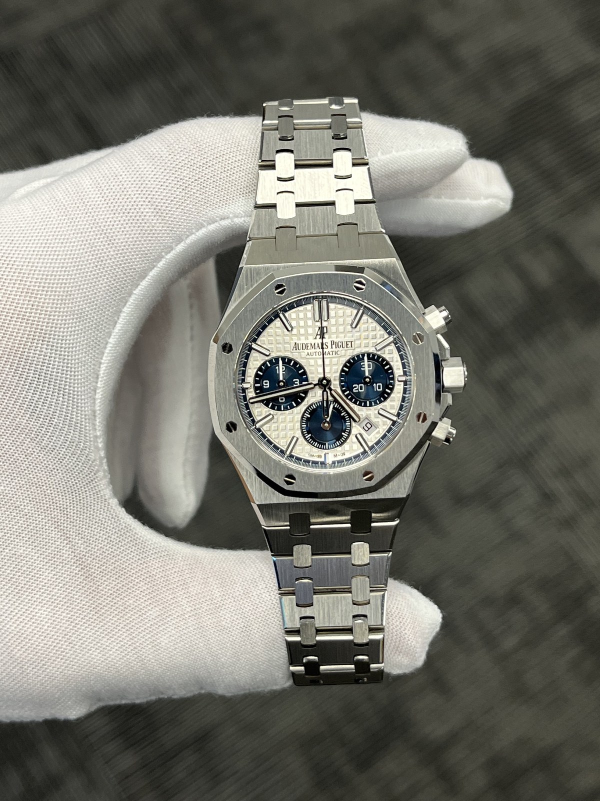 Audemars Piguet Royal Oak chronograph held in a white glove